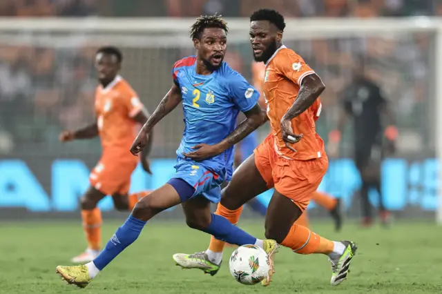 Kessi dribbles the ball in midfield for Ivory Coast.