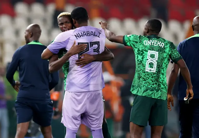 Nwabili is congratulated by his teammates after his heroics.