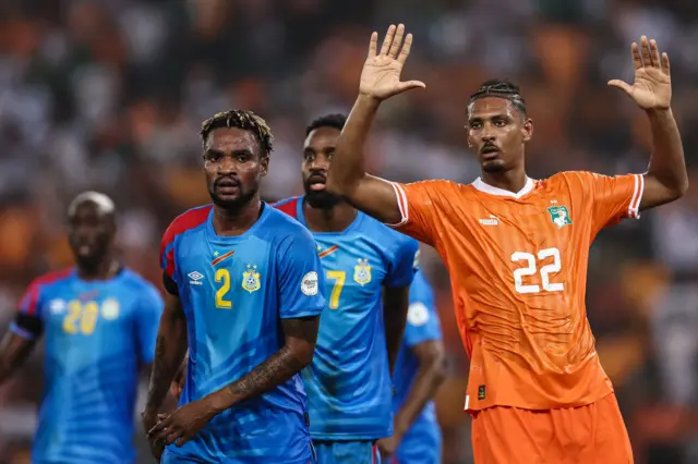 Defenders flock around Sebastien Haller in the box.