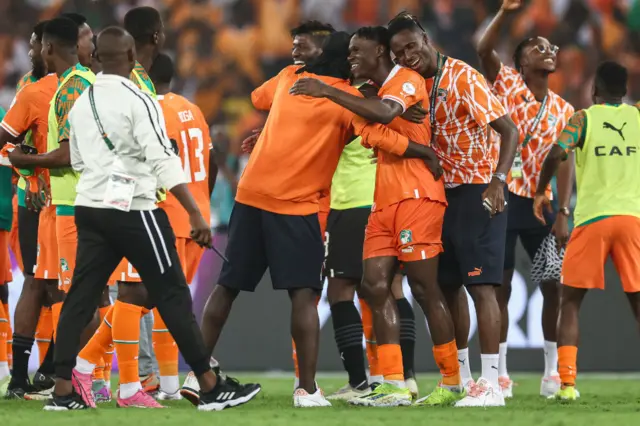 Ivory Coast players celebrate at full time.