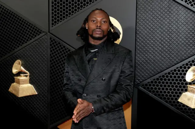 Asake poses on the Grammys red carpet