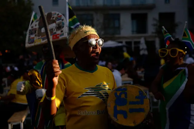 A south africa fan chants outside the ground.