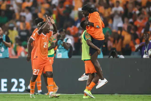 Ivory Coast players celebrate at full time.