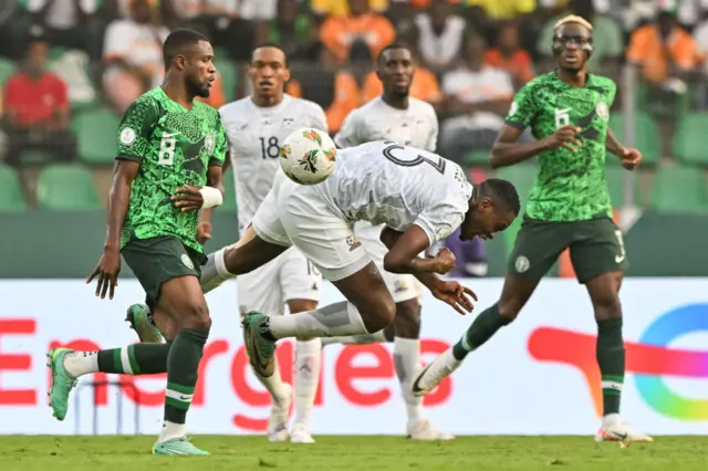 Nigeria struggle to play the ball on as South Africa press high.