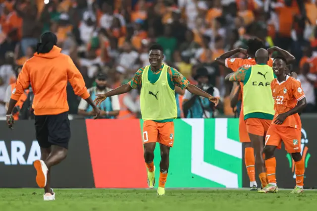 Ivory Coast players celebrate at full time.