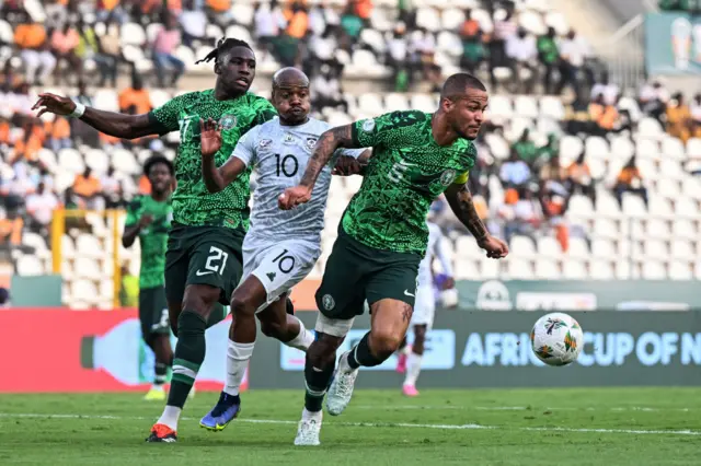 Mudau is crowded out by two Nigeria defenders as he looks to break into the box.