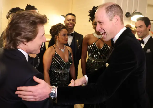 Tom Cruise greets Prince William at a charity event in London, 7 February 2024