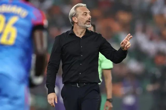 Desabre gives instfructions to his DRC players.