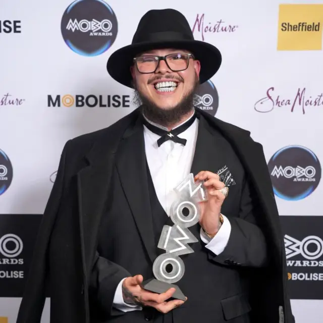 Potter Payper poses with his award