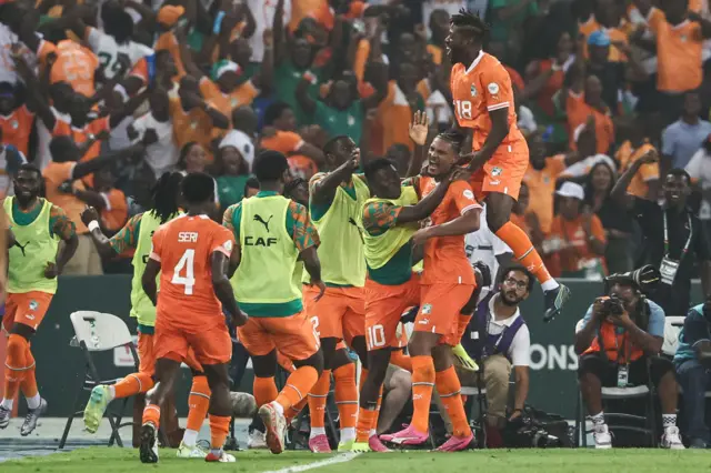 Sebastien Haller is mobbed by teammates after scoring the opener.