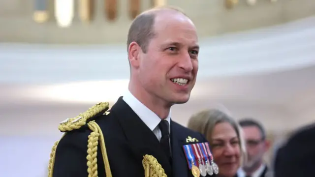 Prince William, Prince of Wales smiles during a visit to The Lord High Admiral's Divisions at Britannia Royal Naval College on 14 December 2023