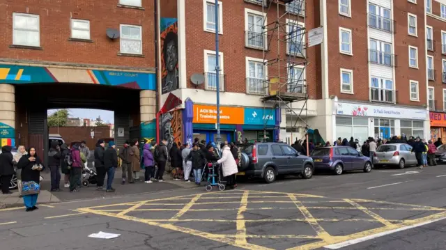 People queue to register for NHS treatment at a dentist in Bristol