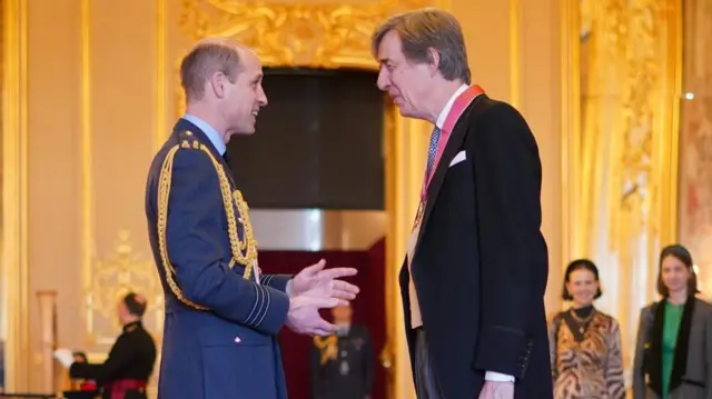 Edward Harley, right, is made a Commander of the Order of the British Empire by the Prince of Wales at Windsor Castle.