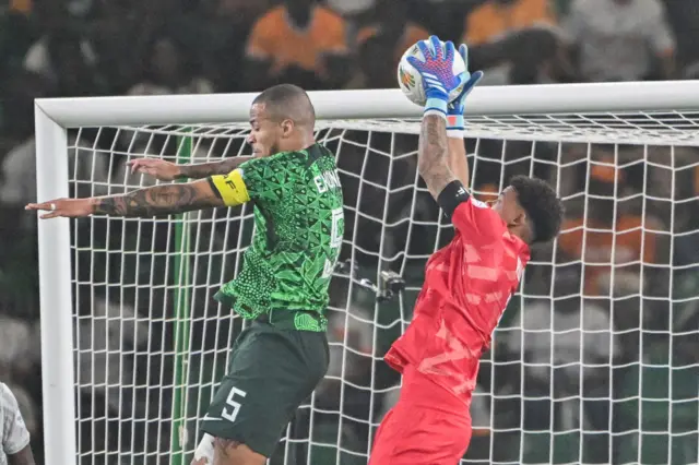 WIlliams claims a cross above the head of Troost Ekong.