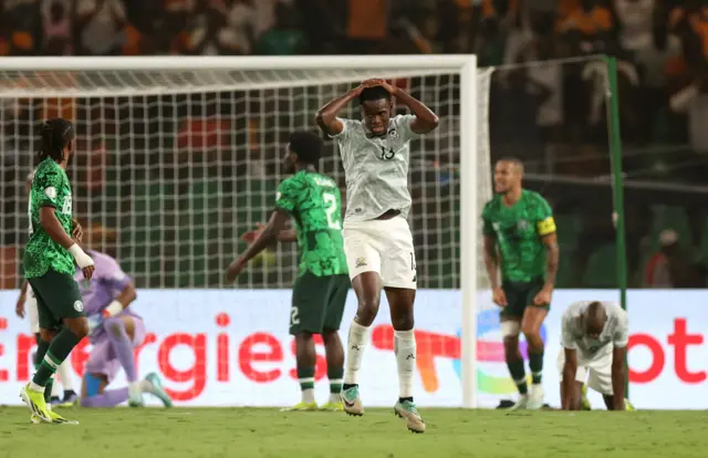 South AFrica players hold their hands to their heads after a missed chance for a winning goal.