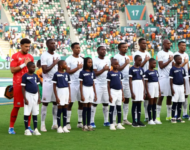 South Africa players sing their national anthem before the game.