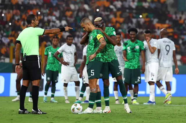 Osimhen offers support to Troost-Ekong before he takes the Nigeria penalty.