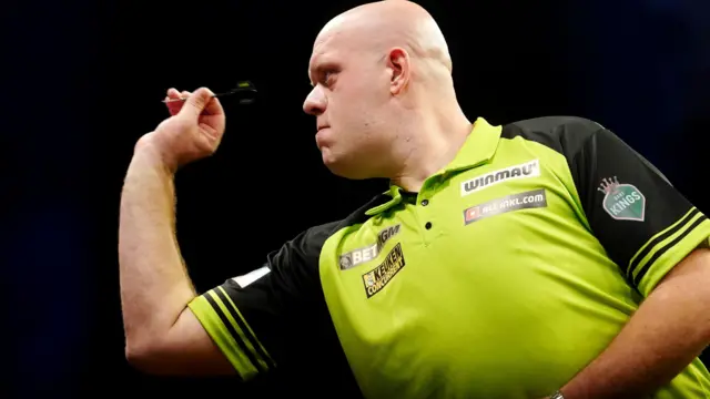 Michael van Gerwen throws a dart