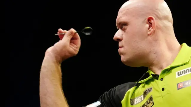 Michael van Gerwen throws a dart