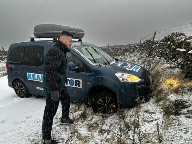 A car resting on an embankment