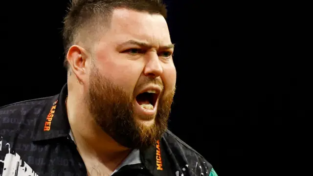 Michael Smith celebrates