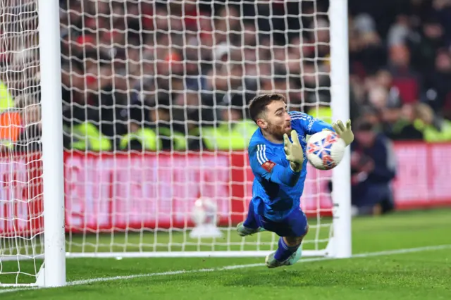 Matt Turner dives to save a penalty