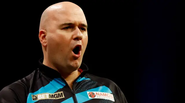 Rob Cross celebrates