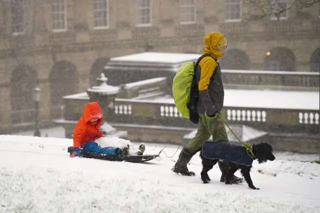 People out enjoying the snow in Buxton, Peak District.