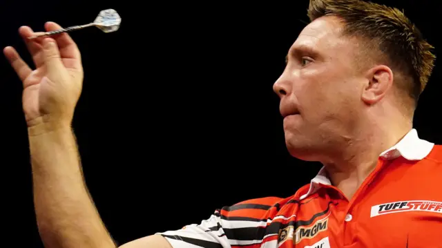 Gerwyn Price throws a dart