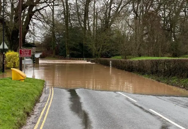 A flooded road in Warwickshire