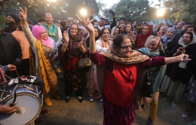 Supporters of Nawaz Sharif - leader of the Pakistan Muslim League Nawaz (PMLN) - react as he spoke in Lahore earlier