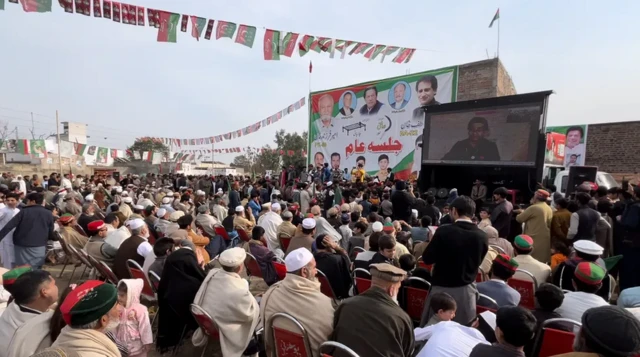 PTI supporters at a rally for candidate Asif Khan