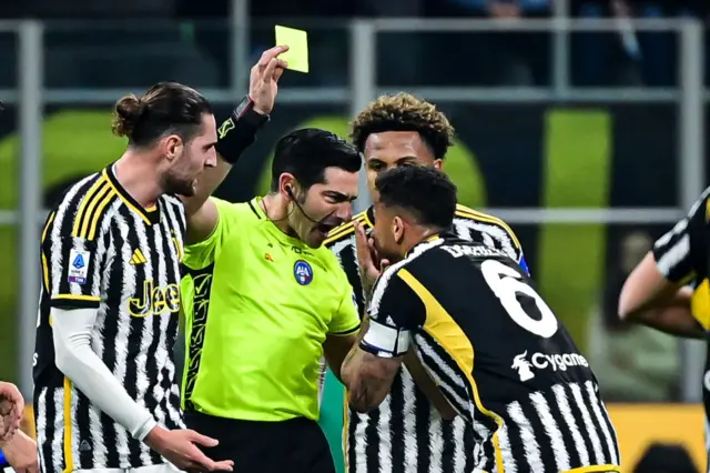 anilo (6) of Juventus receives a yellow card during the Italian Serie A football match Inter Milan and Juventus FC