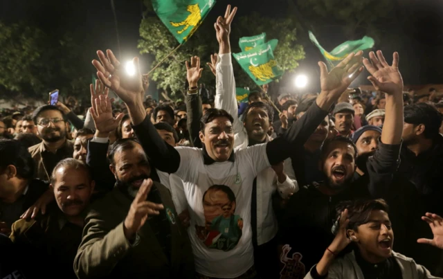 Supporters of Nawaz Sharif - leader of the Pakistan Muslim League Nawaz (PMLN) - react as he spoke in Lahore earlier