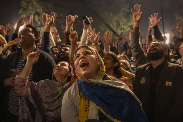 People celebrate a speech by former Prime Minister of Pakistan, Nawaz Sharif, at the party office of Pakistan Muslim League (N), at Model Town in Lahore