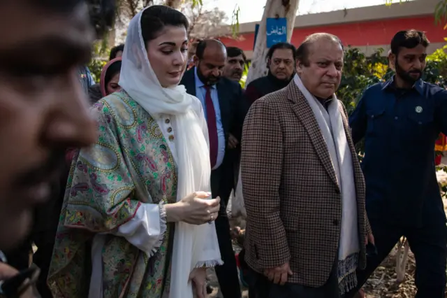 Nawaz Sharif, Pakistan's former prime minister, right, and his daughter Maryam Nawaz Sharif arrive at a polling station in Lahore, Pakistan