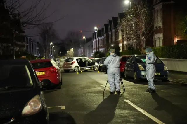 Forensic police at the scene of the crime on Lessar Avenue