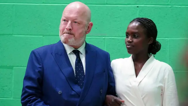 Reform UK candidate Simon Danczuk is in the count centre with his partner Claudine Uwamahoro