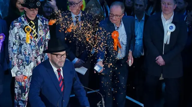 George Galloway has confetti thrown on him