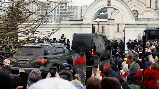 The hearse arriving