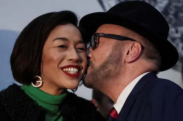 George Galloway kissing his wife