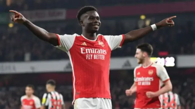 Bukayo Saka celebrates