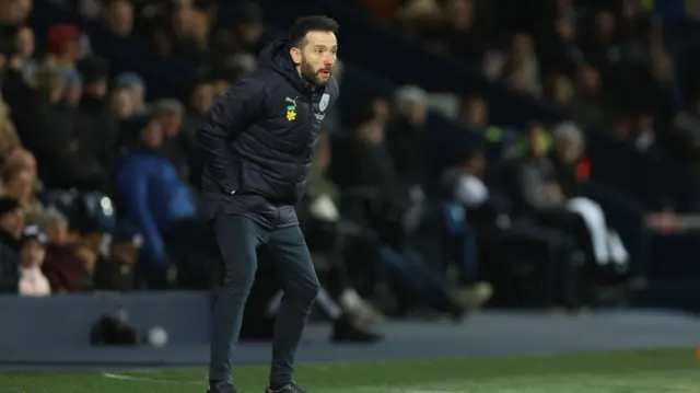 Carlos Corberan looks on from the touchline