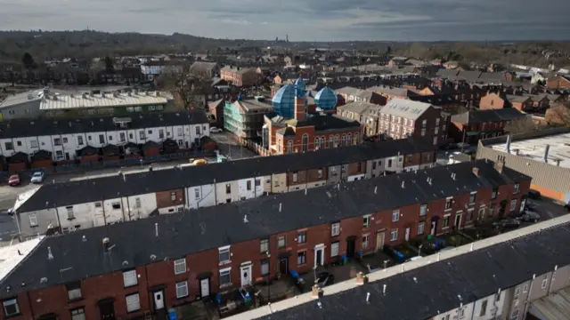 An aerial view of homes and a mosque in Rochdale