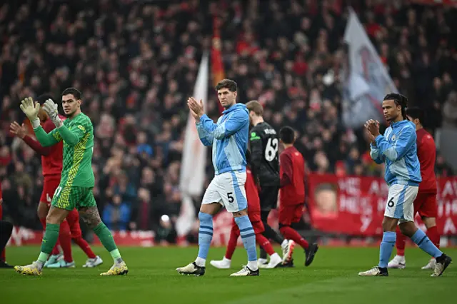 John Stones claps the travelling support