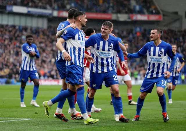 Jakub Moder of Brighton & Hove Albion celebrates with teammates