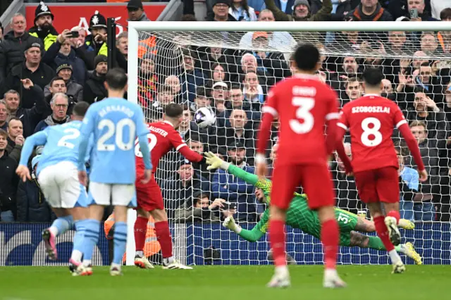 Ederson of Manchester City fails to save a penalty kick from Alexis Mac Allister