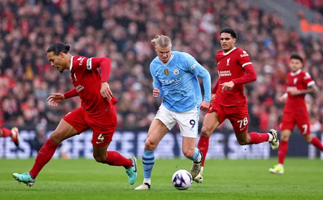 Erlang Haaland of Manchester City makes a run past Virgil van Dijk