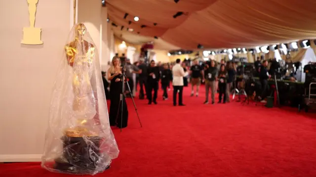 An Oscar statue is covered in plastic as preparations continue for the 96th Academy Awards in Los Angeles, California, U.S., March 9, 2024