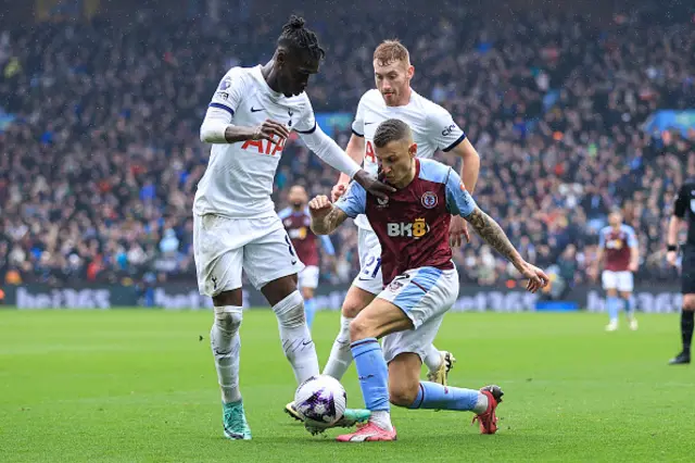 Yves Bissouma of Tottenham Hotspur and Lucas Digne battle for the ball